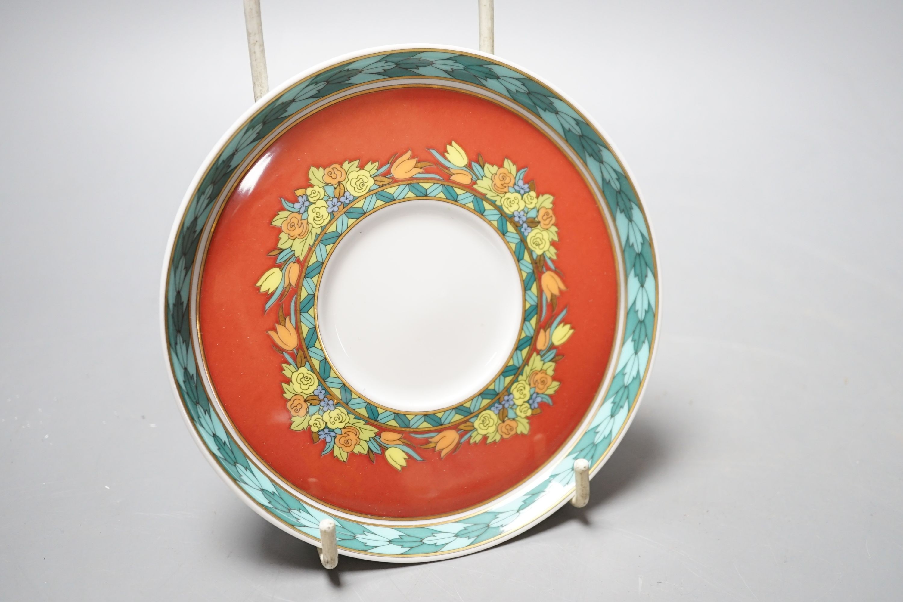 A set of eight Versace 'Le Roi Soleil' pattern cups and saucers